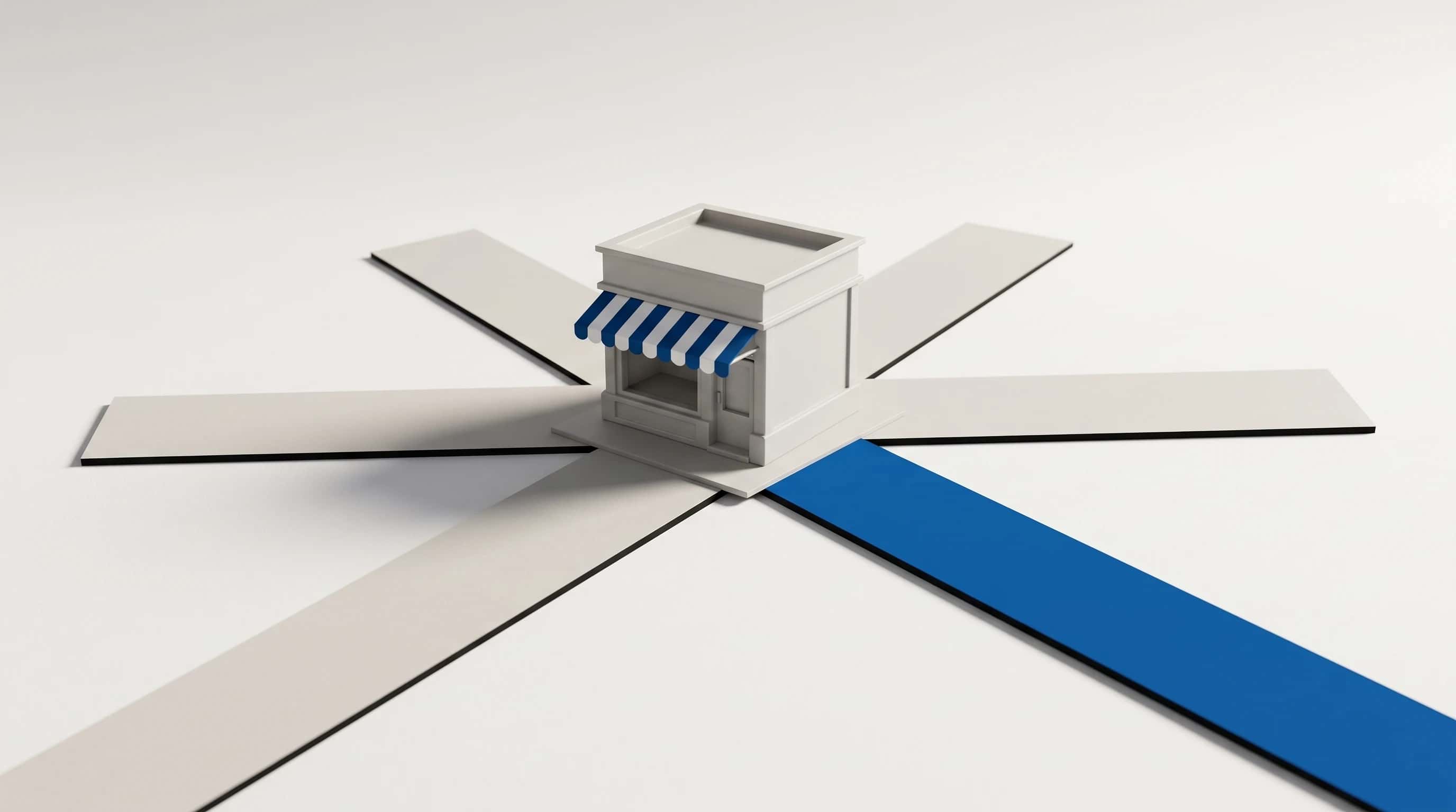 Miniatuurwinkeltje met luifel op een kruispunt van zes papieren wegen, waarvan één in blauw
