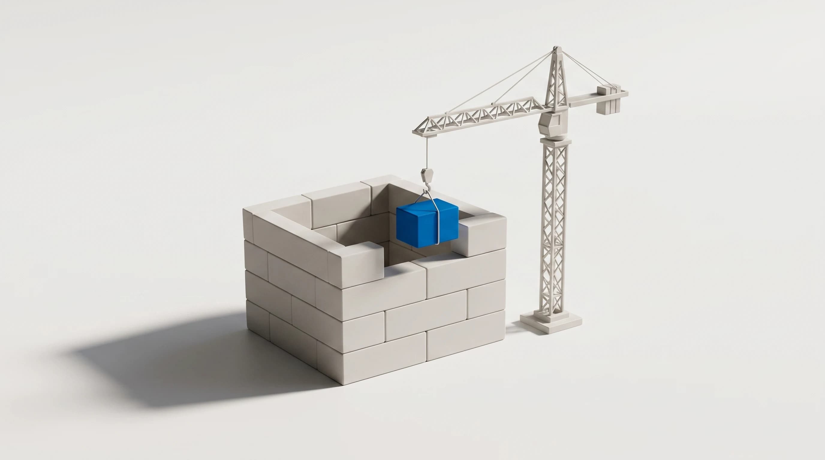 Maquette van een huis in aanbouw uit grijze blokken met een torenkraan die een blauw blok optilt