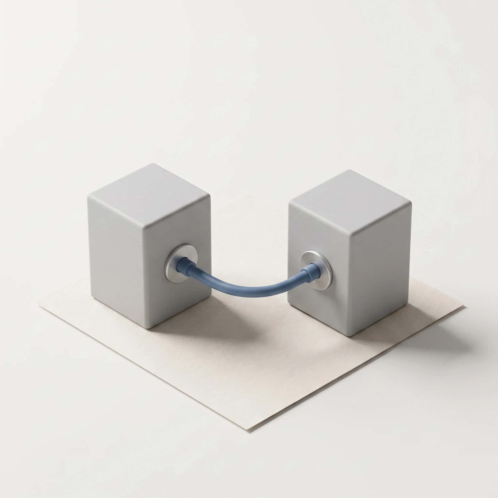Render van twee grijze connectorblokken die met één blauwe kabel verbonden zijn